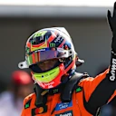 ZANDVOORT, NETHERLANDS - AUGUST 30: Pole position qualifier Oscar Piastri of Australia and McLaren waves in parc ferme during qualifying ahead of the F1 Grand Prix of Netherlands at Circuit Zandvoort on August 30, 2025 in Zandvoort, Netherlands. (Photo by Mark Thompson/Getty Images)