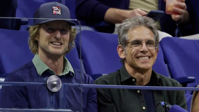 Ben Stiller and Owen Wilson watch a match between Novak Djokovic, of Serbia, and Taylor Fritz, of the United States, during the quarterfinal