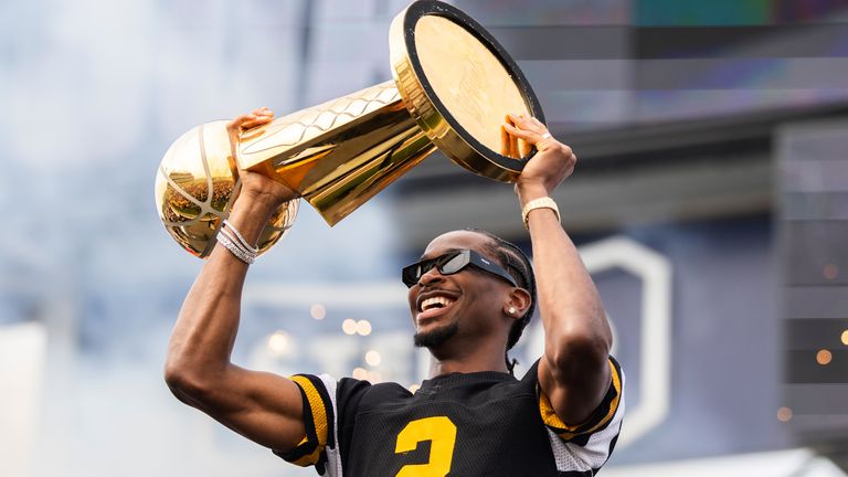 Oklahoma City Thunder's Shai Gilgeous-Alexander holds up the Larry O'Brien Trophy (Nick Iwanyshyn/The Canadian Press via AP)